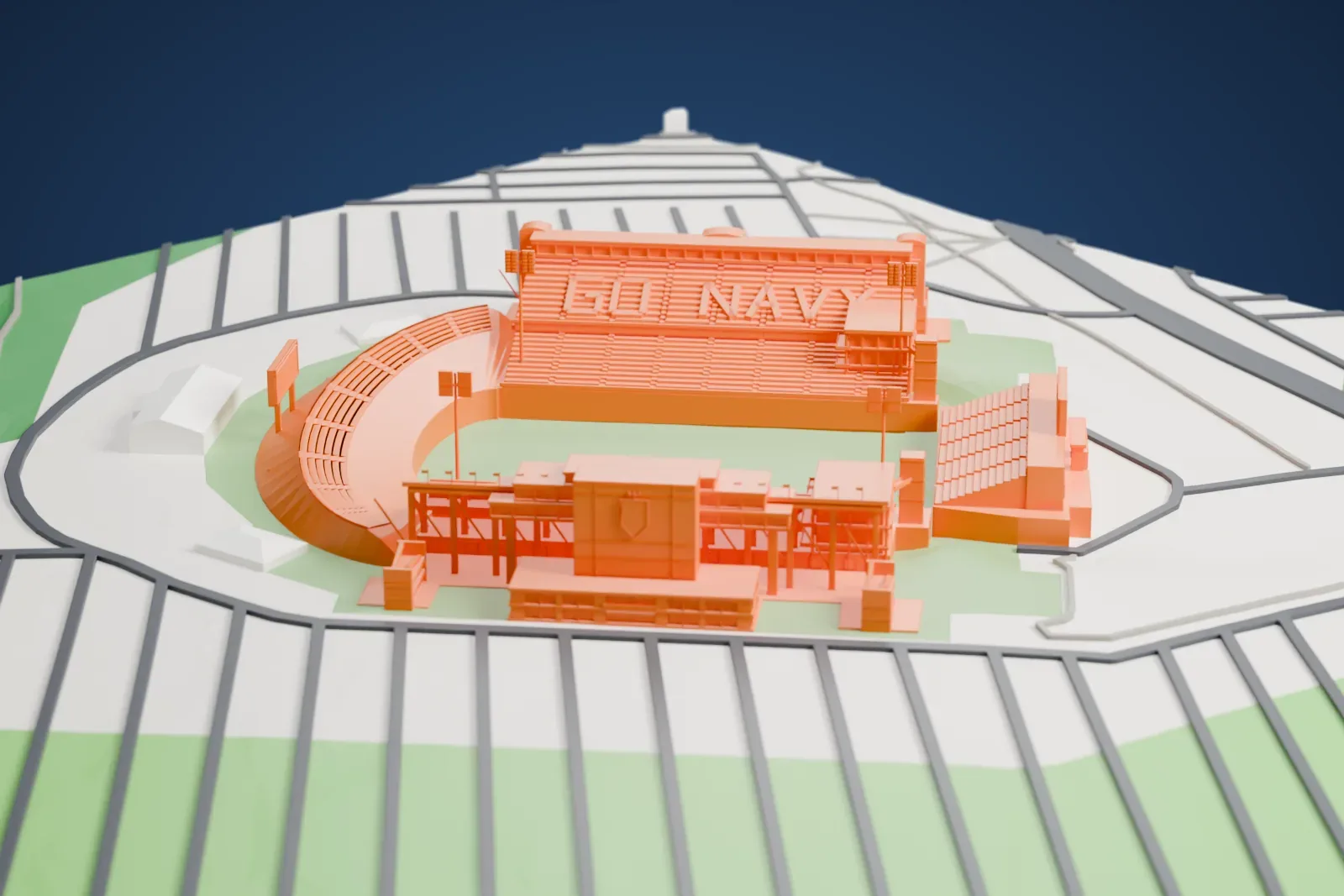 A white 3D print of Navy–Marine Corps Memorial Stadium in Annapolis, with the surrounding streets and buildings around it.
