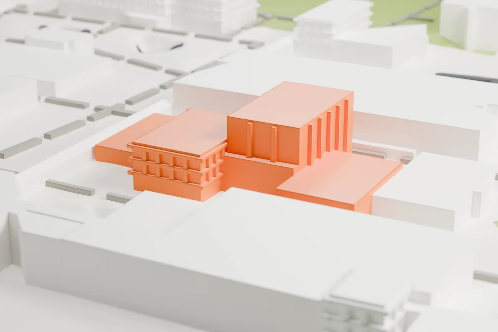 A white 3D print of the Neuberger Museum of Art, a cluster of joined blocks of different heights with ridged roof features, beside lawns and paved areas.
