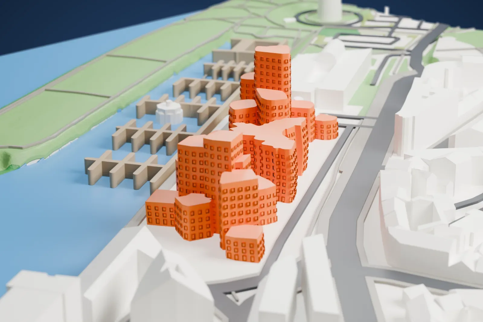 A white 3D print of the three Neuer Zollhof buildings with their curving facades, standing among the surrounding streets and buildings.