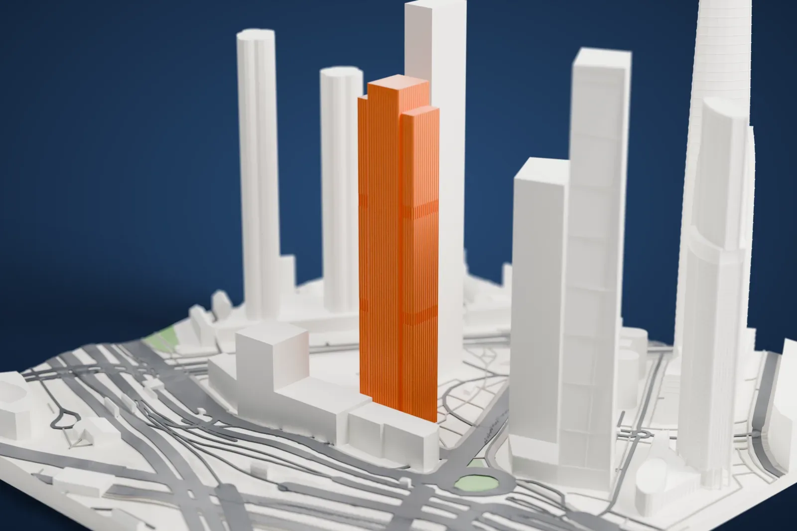 A white 3D print of Neva Towers, two tall skyscrapers on a shared base, standing among the city buildings and streets of the Moscow International Business Center.