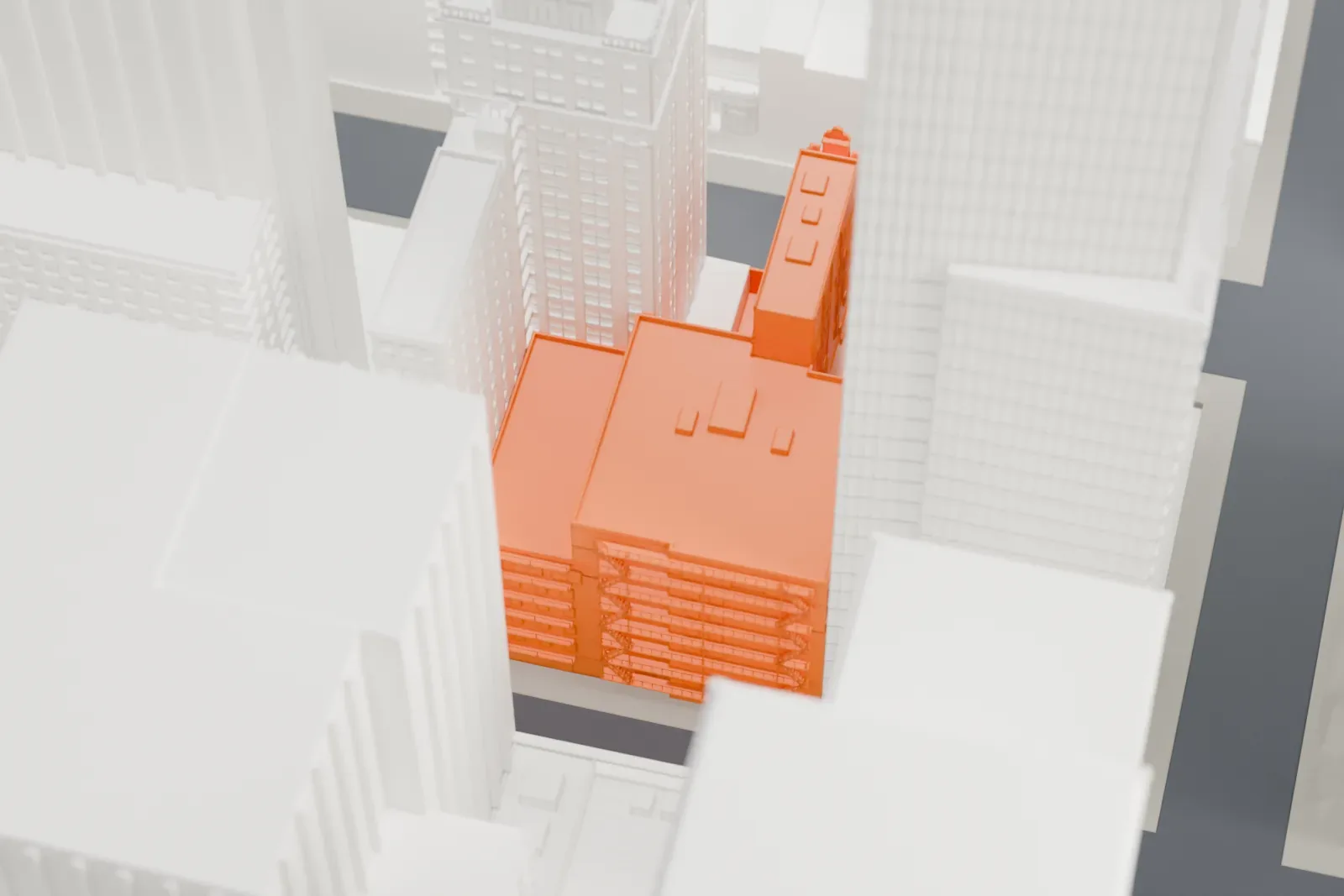 A white 3D print of the New Amsterdam Theatre, a small building hemmed in by much taller towers in dense city blocks.