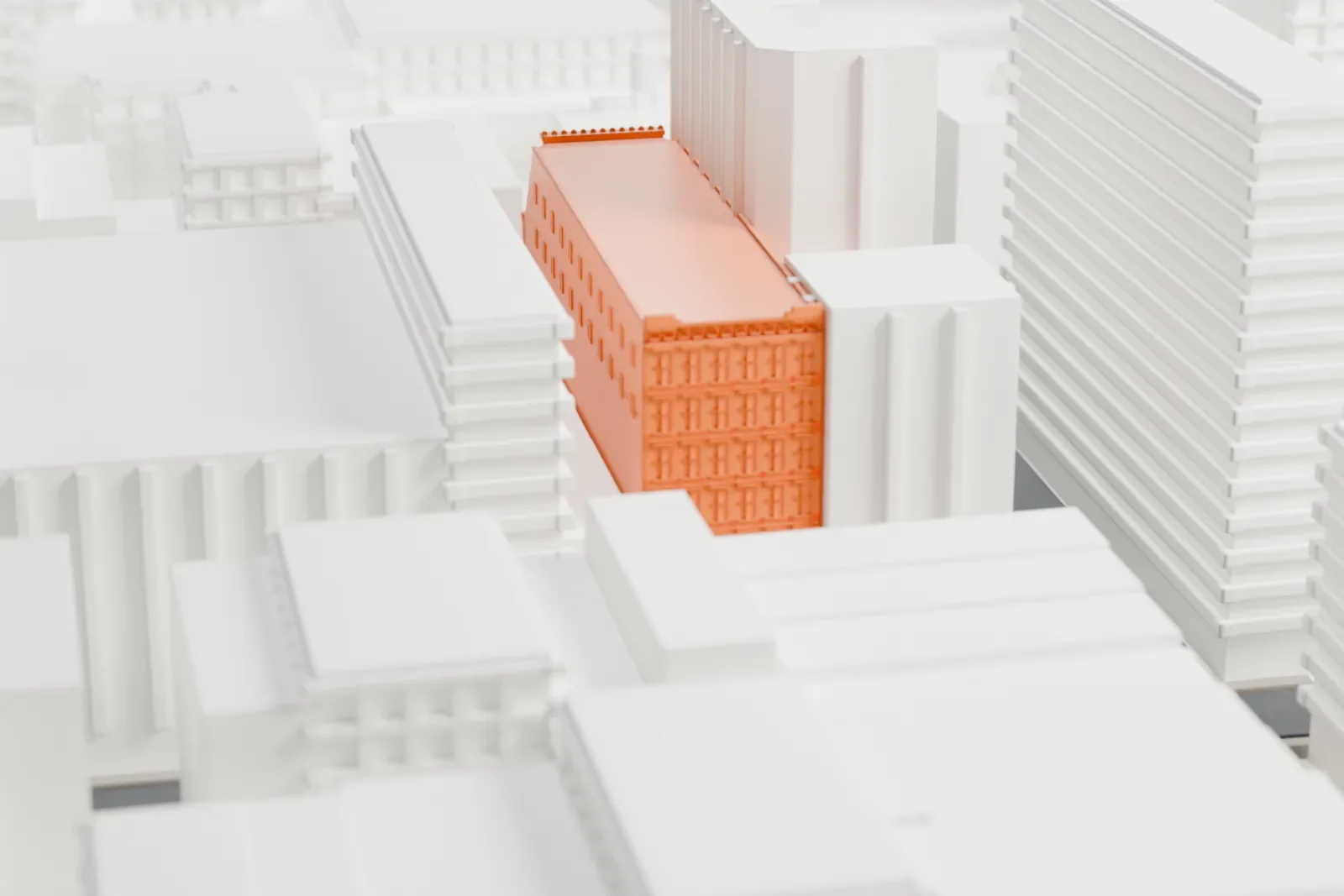 A white 3D print of the New Era Building, a long ornate building running back through a block of taller and lower buildings.