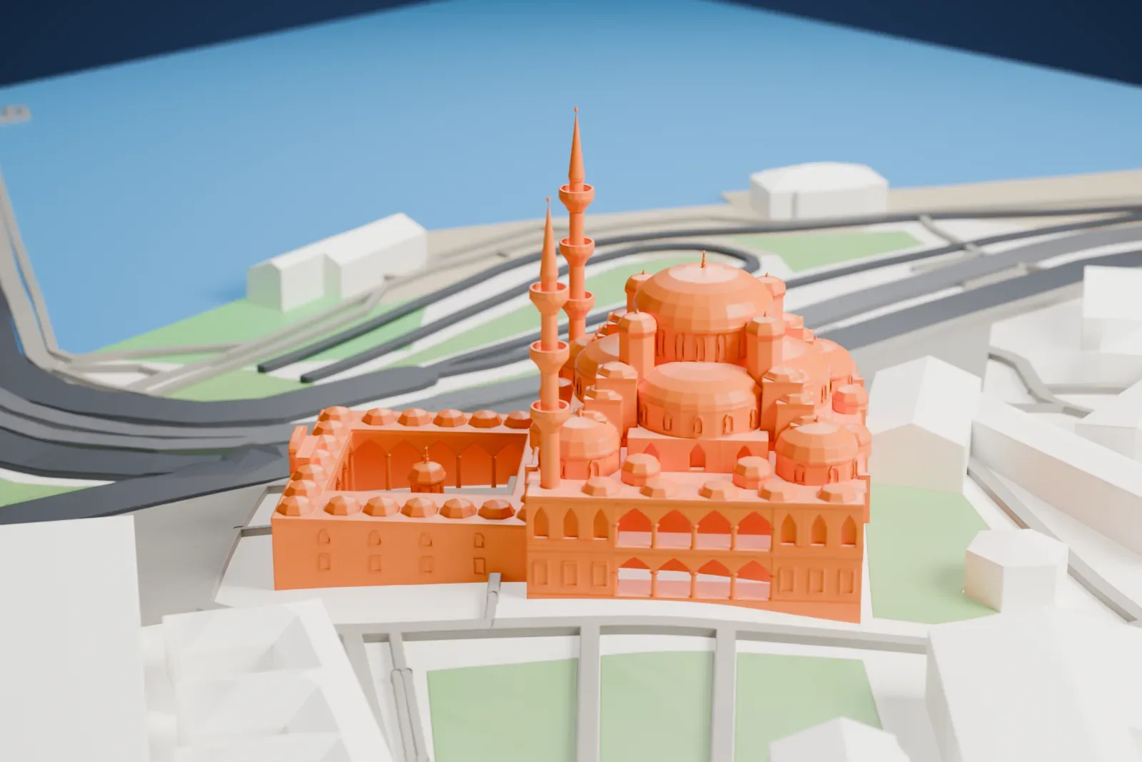A white 3D print of the New Mosque, with a cluster of domes, two minarets and a courtyard among surrounding city buildings.