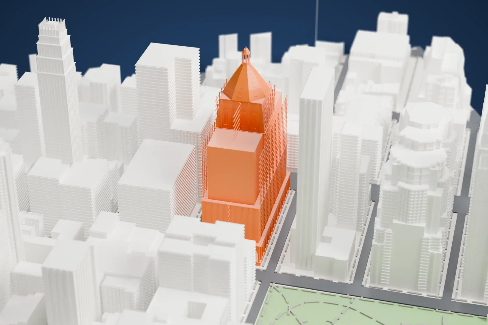 A white 3D print of the New York Life Building with its pyramidal roof among surrounding buildings and streets, with a park edge beside them.