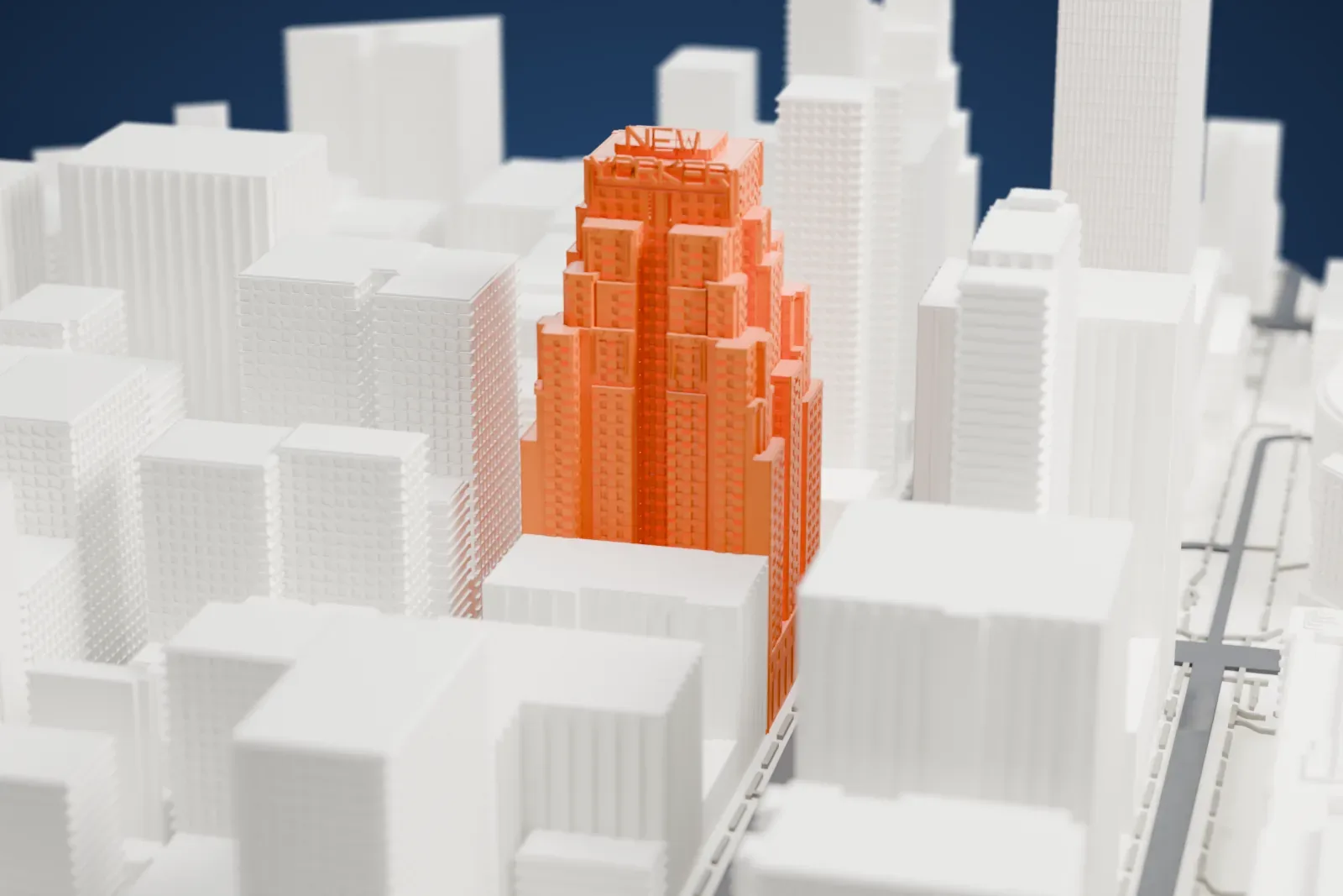 A white 3D print of the New Yorker Hotel, a tall tower with many stepped setbacks and raised lettering on top, among mid-rise and tall Midtown buildings.