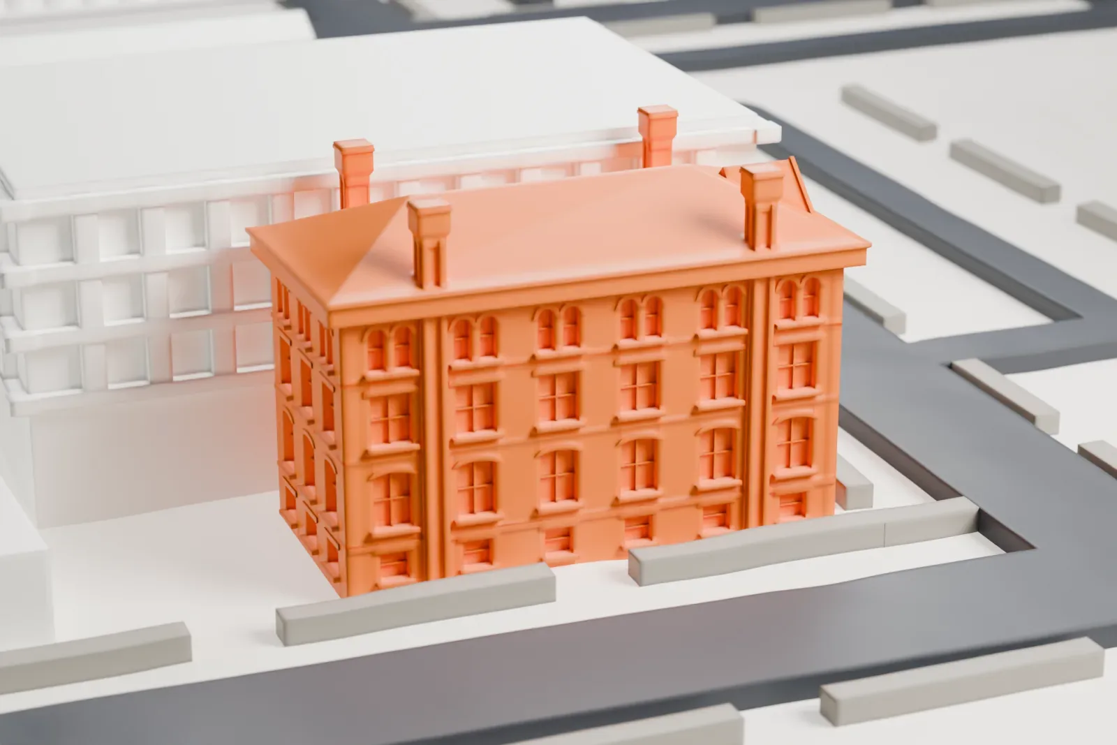 A white 3D print of the Newark Female Charitable Society building, a brick building with a gabled roof and chimneys, beside a taller building and streets.