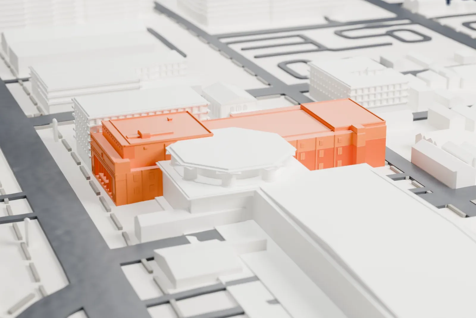 A white 3D print of Newark Symphony Hall, a large multi-part building with a columned front, beside an octagonal neighbor and low city blocks.