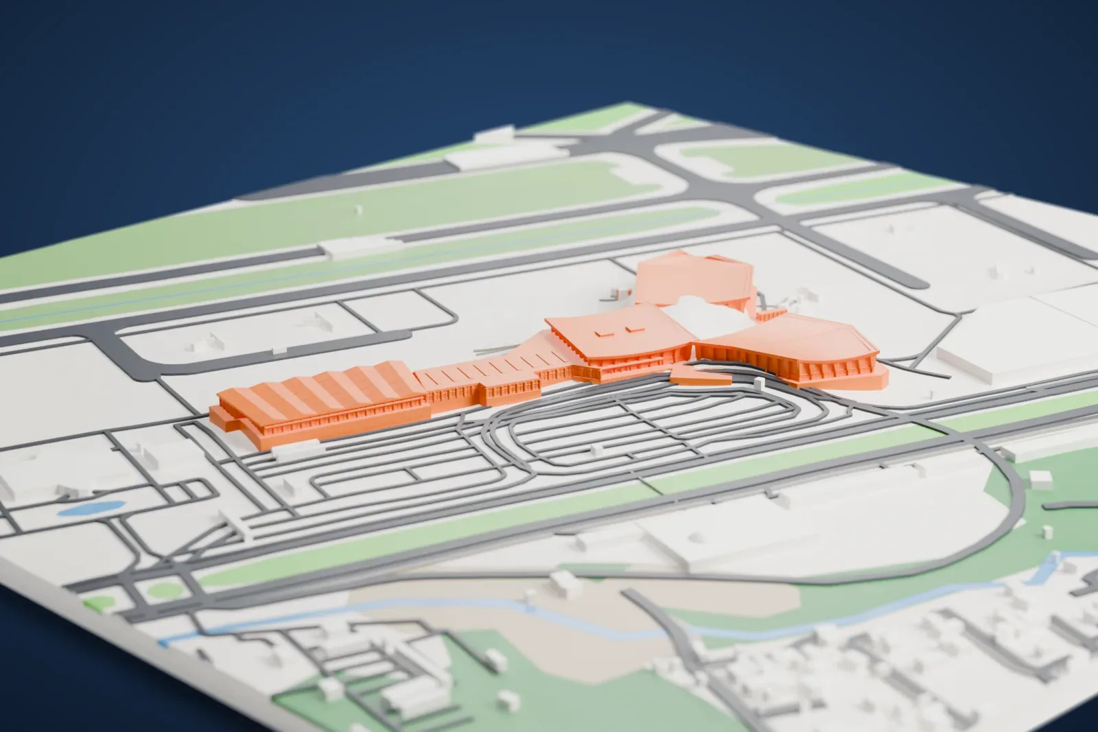 A white 3D print of Noi Bai International Airport Terminal 1, an airport terminal building, among the surrounding area.