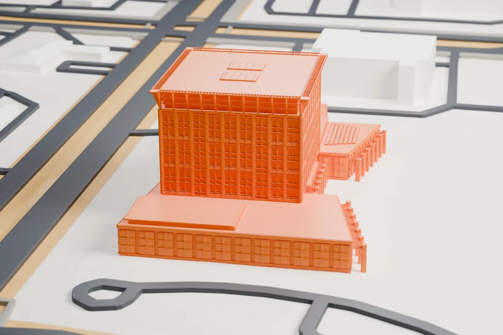 A white 3D print of the North Las Vegas City Hall, a low civic building, among the surrounding streets and buildings.