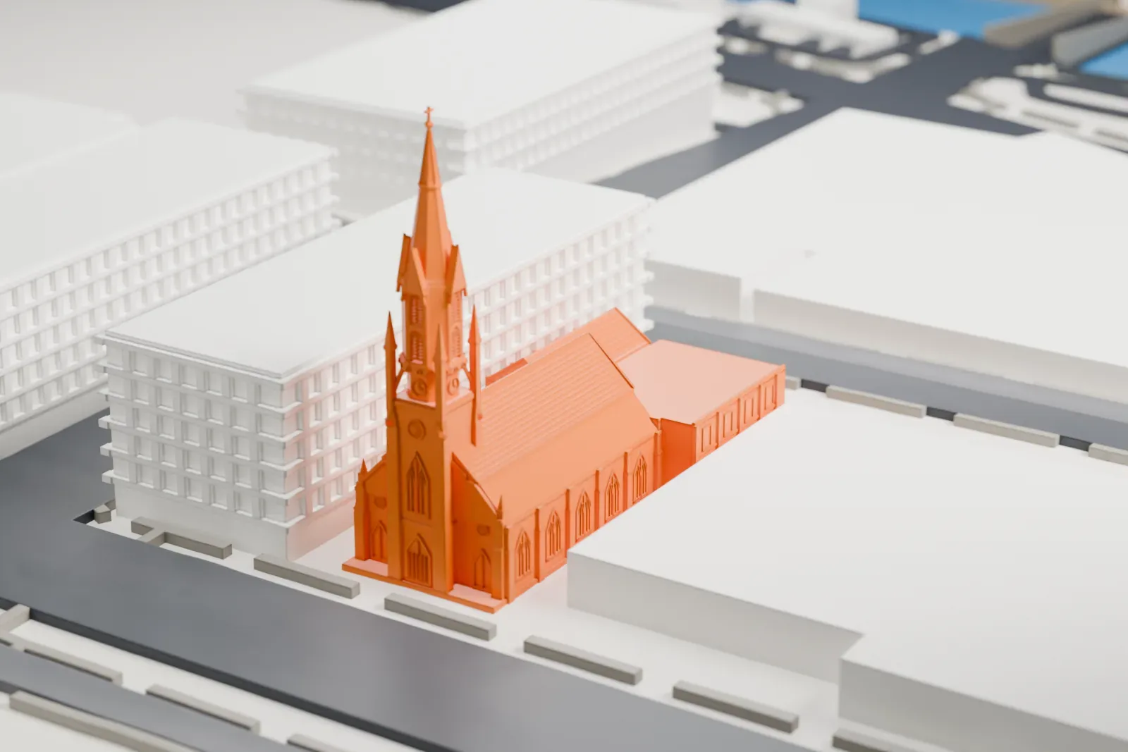 A white 3D print of North Reformed Church, a gabled church with a tall pointed spire, standing among larger buildings and streets.