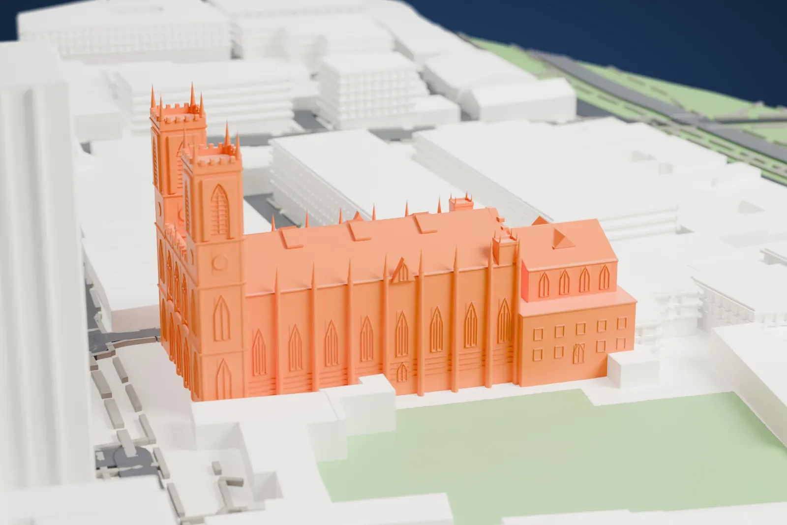 A white 3D print of Notre-Dame Basilica, a long church with a gabled roof, pinnacled towers and rows of pointed windows, surrounded by dense city buildings and an open green space.