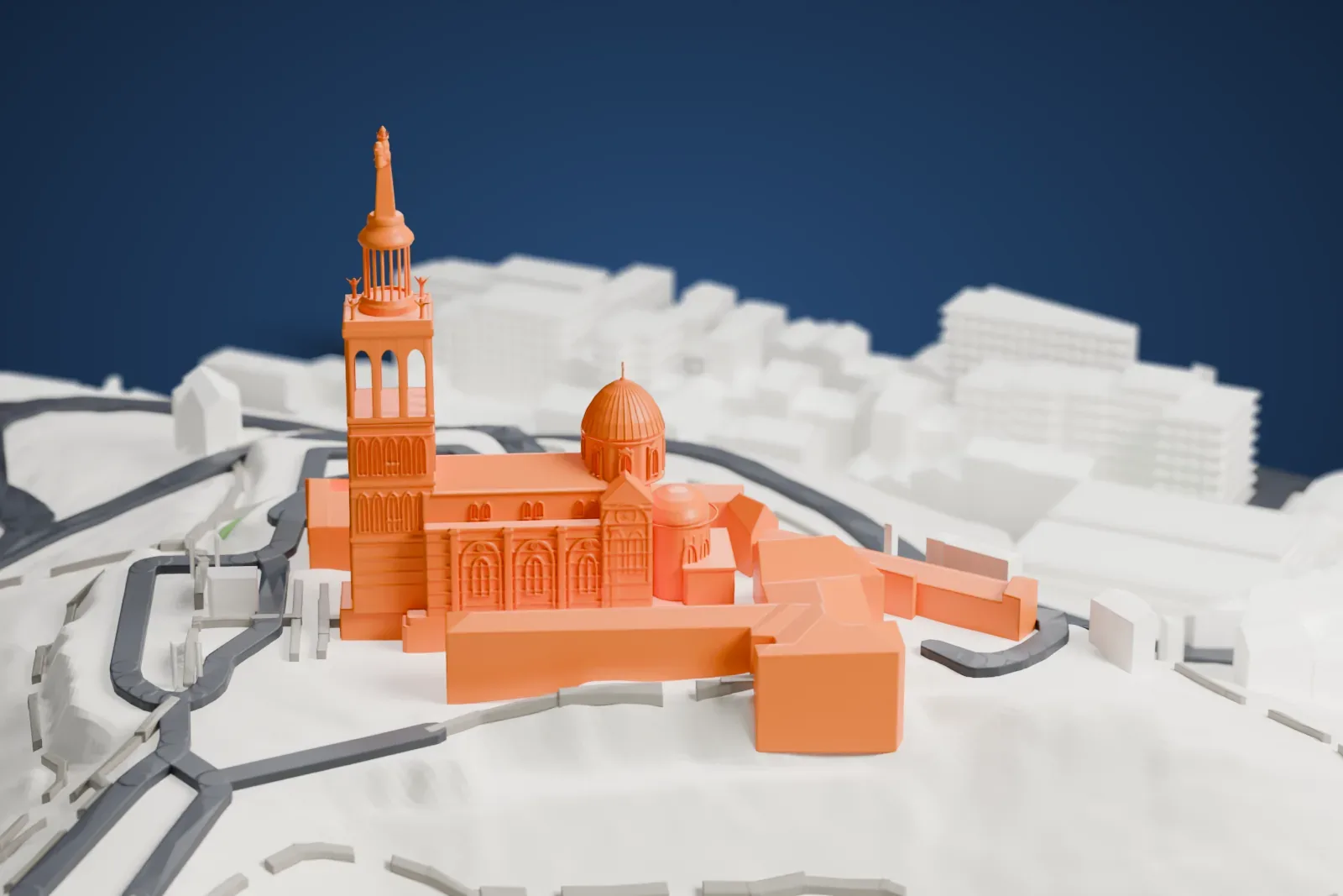 A white 3D print of Notre-Dame de la Garde, a basilica with a tall bell tower topped by a slim spire and statue and a domed roof, standing on a steep rocky slope with roads and buildings around it.