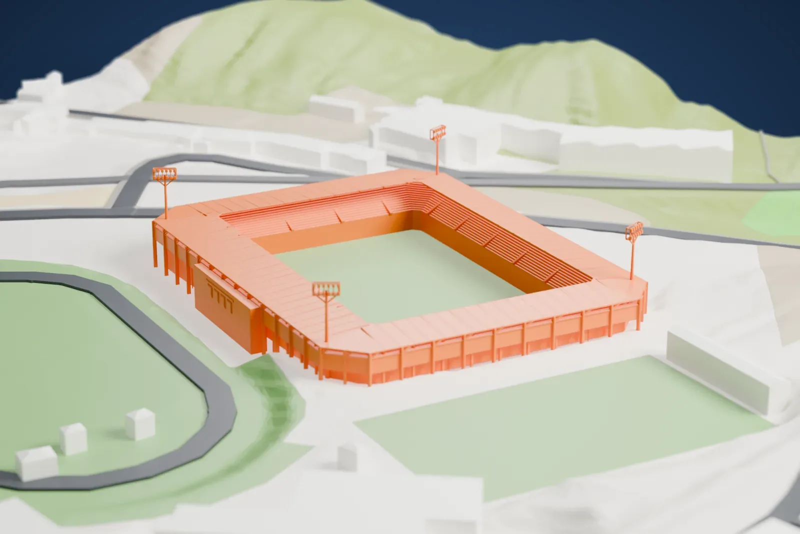 A white 3D print of Nuevo Estadio Los Pajaritos, a compact football stadium with roofed stands and four floodlight masts, next to an athletics ground and surrounding roads.