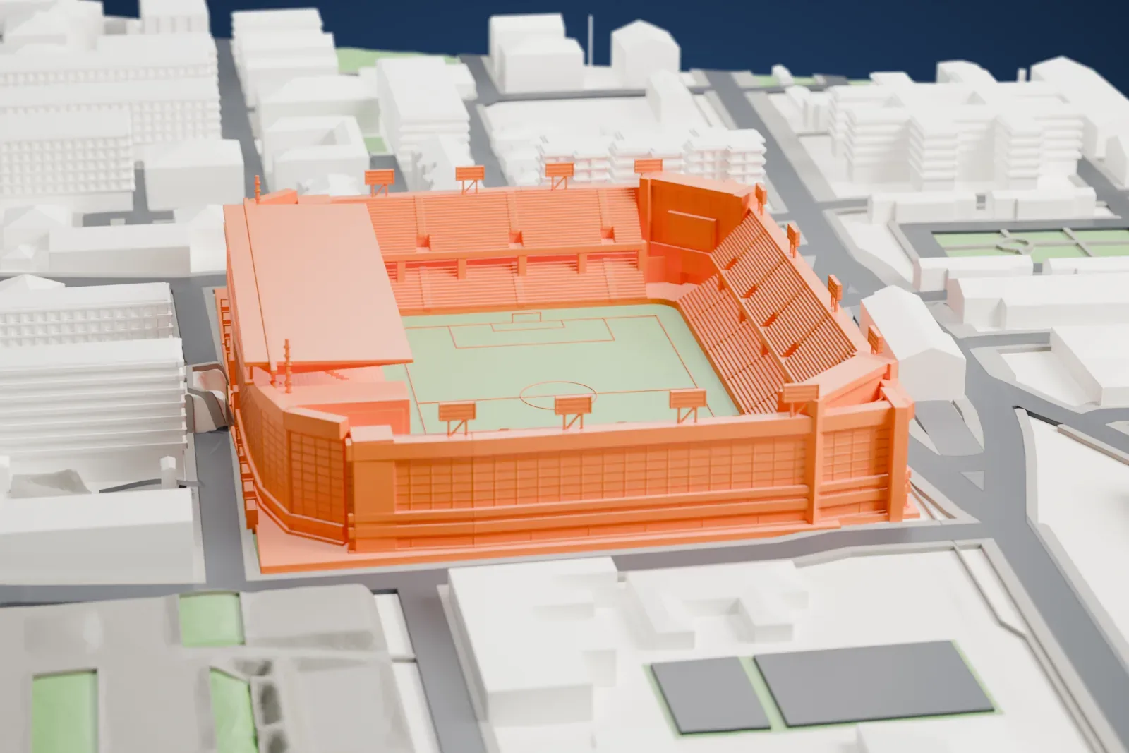 A white 3D print of Nuevo Mirandilla, a rectangular football bowl with a tall main stand and a long roof, surrounded by the buildings of Cádiz.
