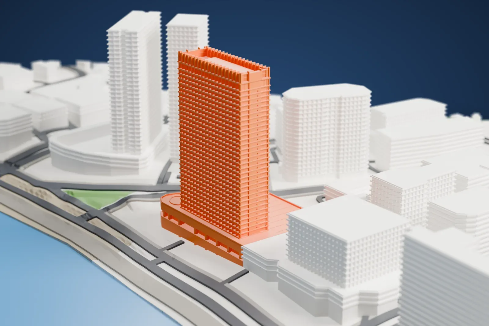 A white 3D print of the Trident Nariman Point, a slender hotel tower with a comb-like crown above its podium in the surrounding city.