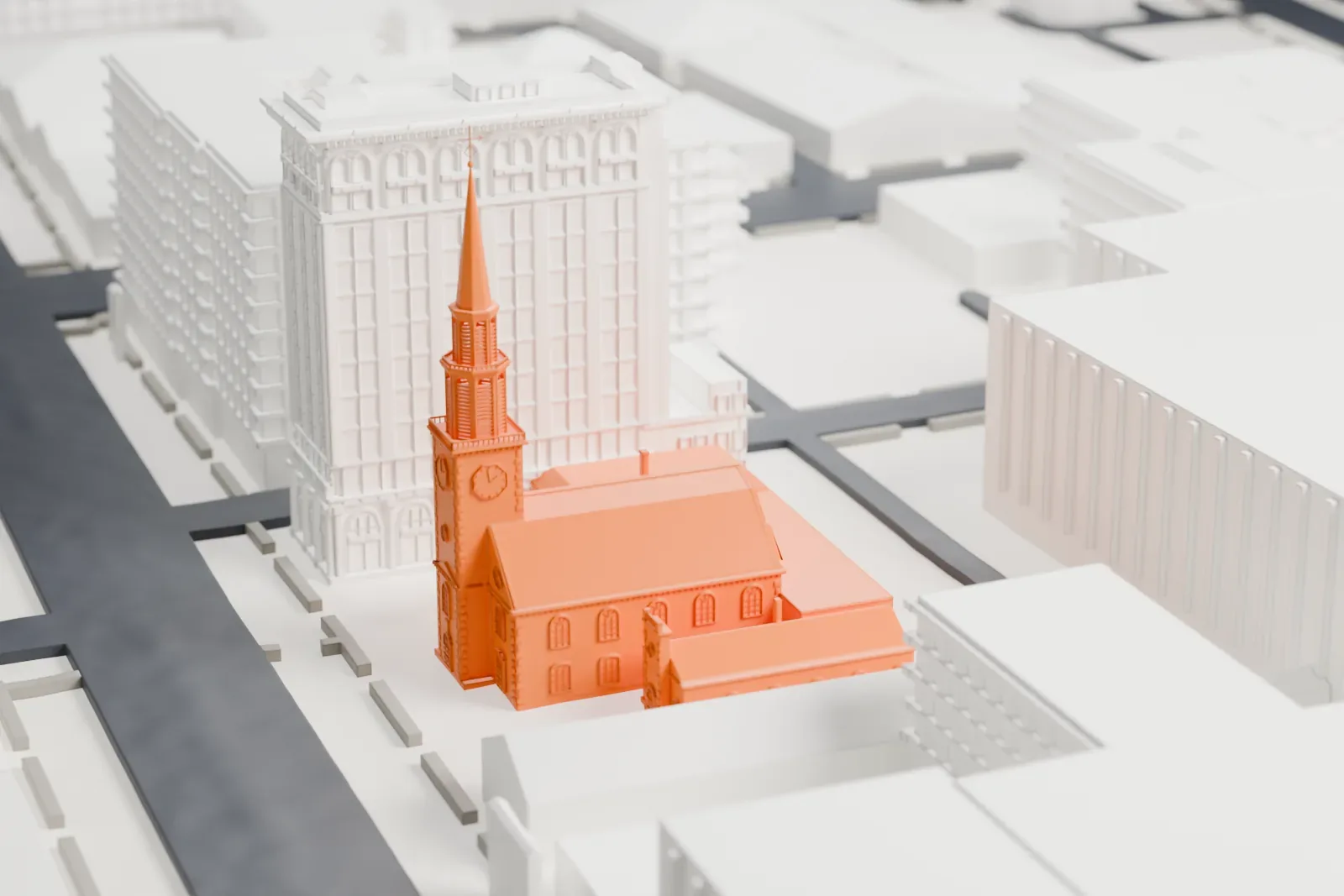 A white 3D print of Old First Presbyterian Church, a church with a clock tower and slender spire beside an ornate tall building.