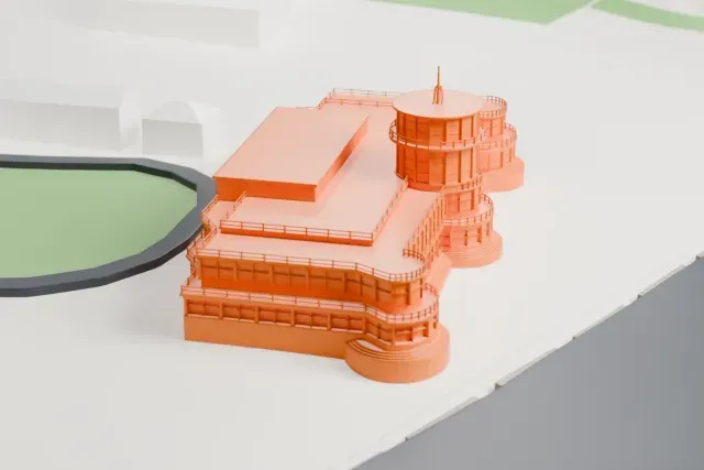 A white 3D print of the Old Kallang Airport Terminal model in Singapore, with the streets around it.