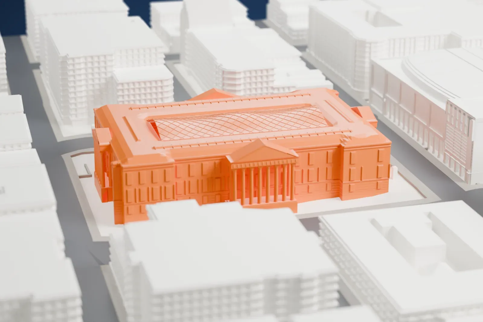 A white 3D print of the Old Patent Office Building, a large city-block building, among the surrounding streets and buildings.