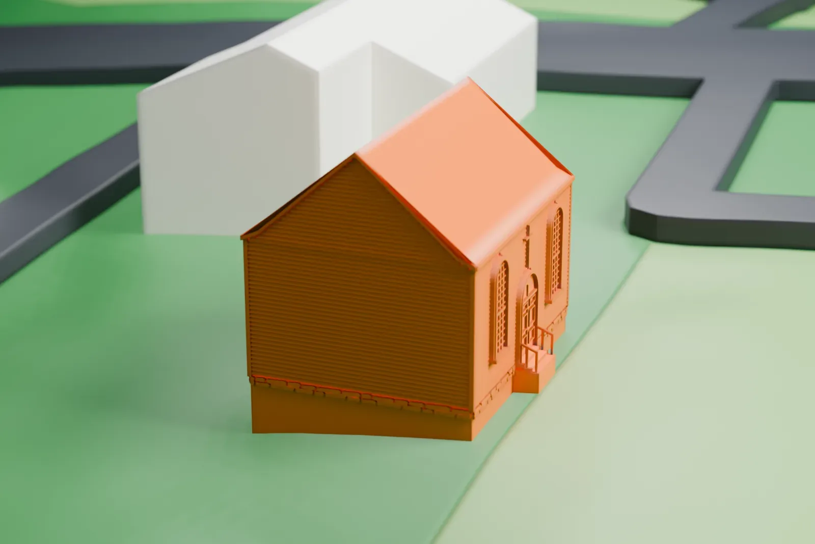 A white 3D print of Old St. Peter's Church, a small gabled building with arched windows and an entrance with steps, on green grounds with a nearby road and a few buildings.