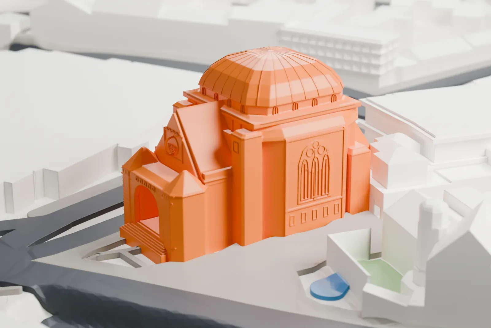 A white 3D print of the Old Synagogue in Essen among the surrounding streets and buildings.