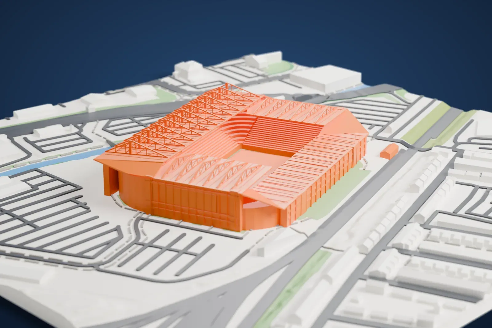 A white 3D print of Old Trafford, a football stadium with tiered stands and a roof of angled trusses around an open pitch, beside a narrow waterway, terraced streets and car parks.