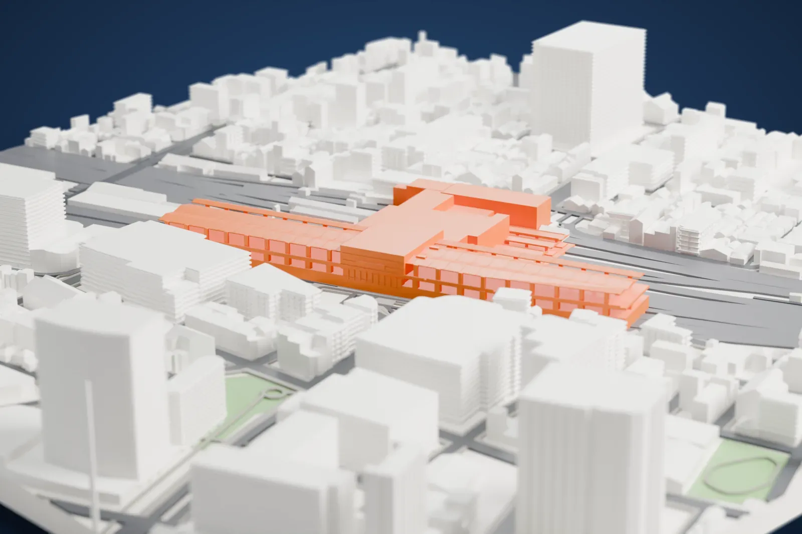 A white 3D print of Ōmiya Station among the surrounding streets and buildings.