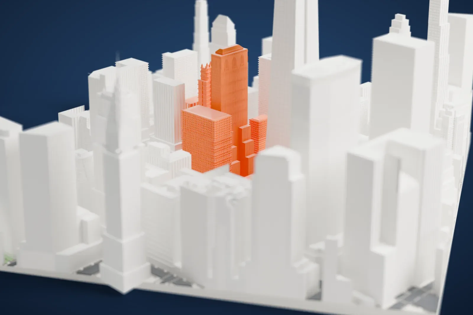 A white 3D print of One Grand Central Place, a slim tower with a stepped base and pointed windows under its crown, standing among dense tall buildings.