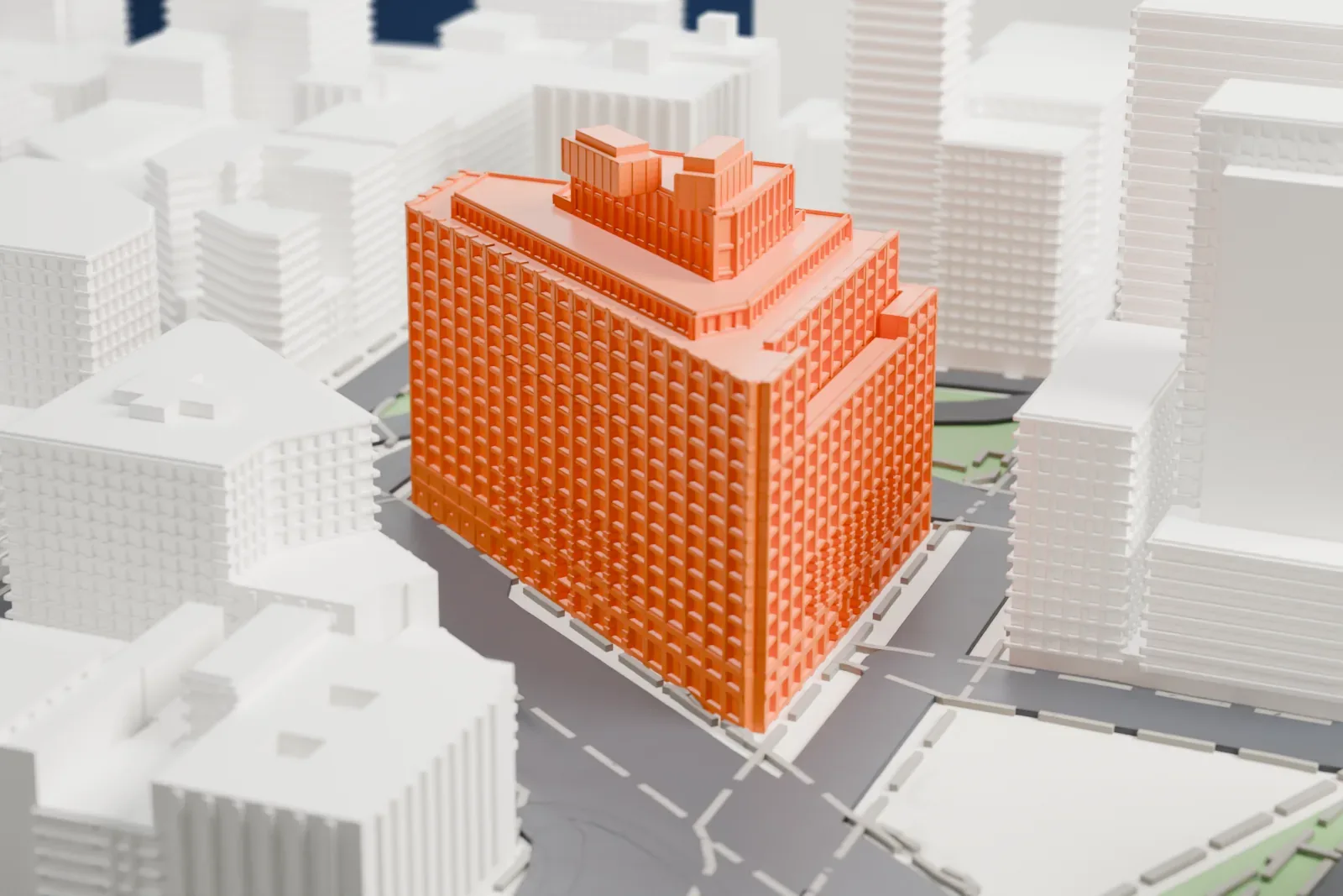 A white 3D print of One Hudson Square, a wide windowed building with a stepped top, surrounded by streets, small green islands and other buildings.