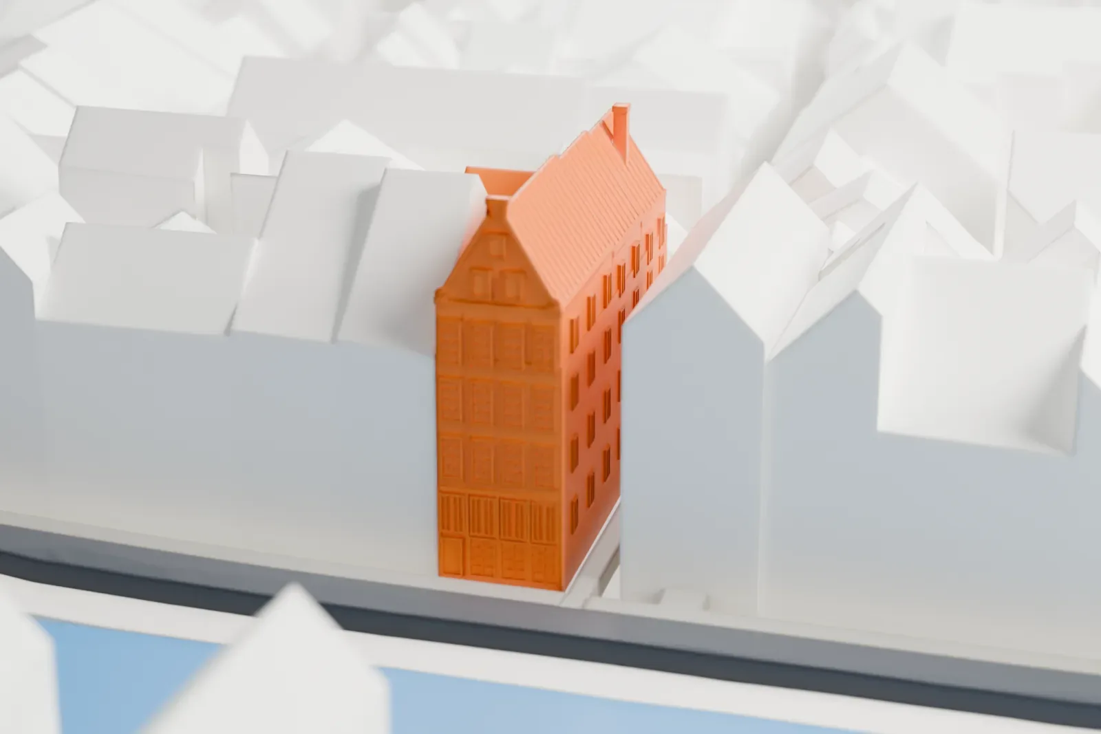 A white 3D print of Ons' Lieve Heer op Solder with the surrounding streets and buildings.