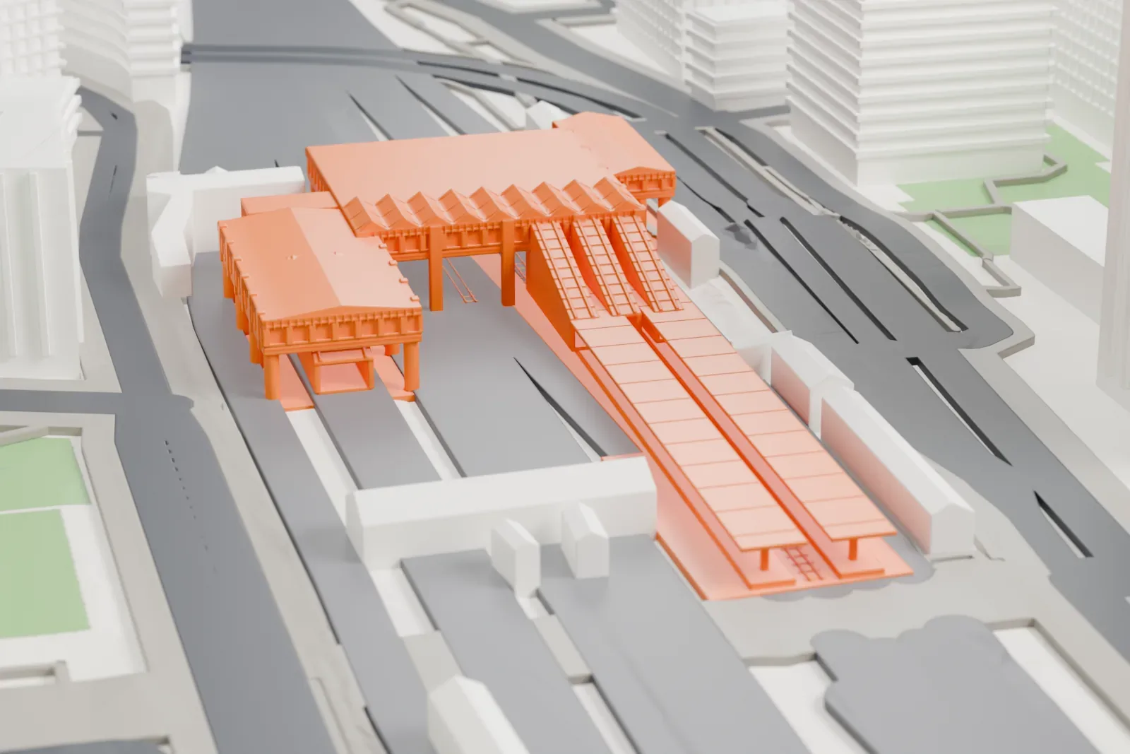 A white 3D print of Ōsaki Station, a long low railway station, among surrounding streets and buildings in Tokyo.