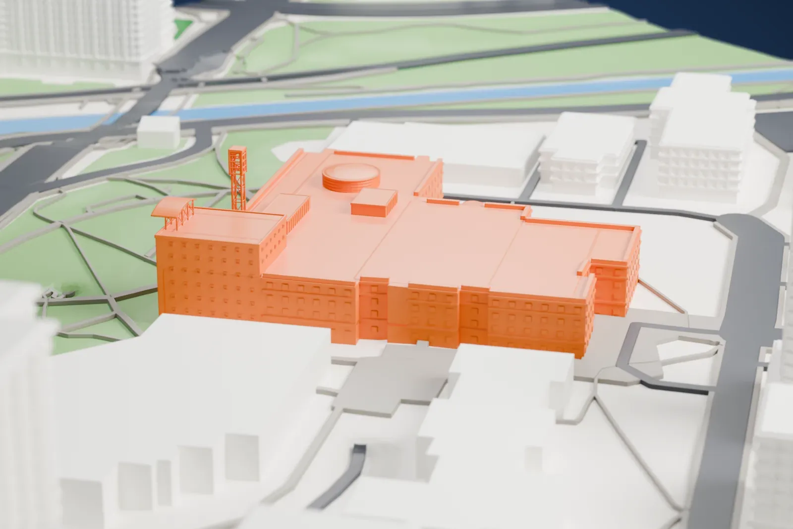 A white 3D print of Ottawa City Hall, a modern building joined to an older wing, among surrounding streets and buildings.