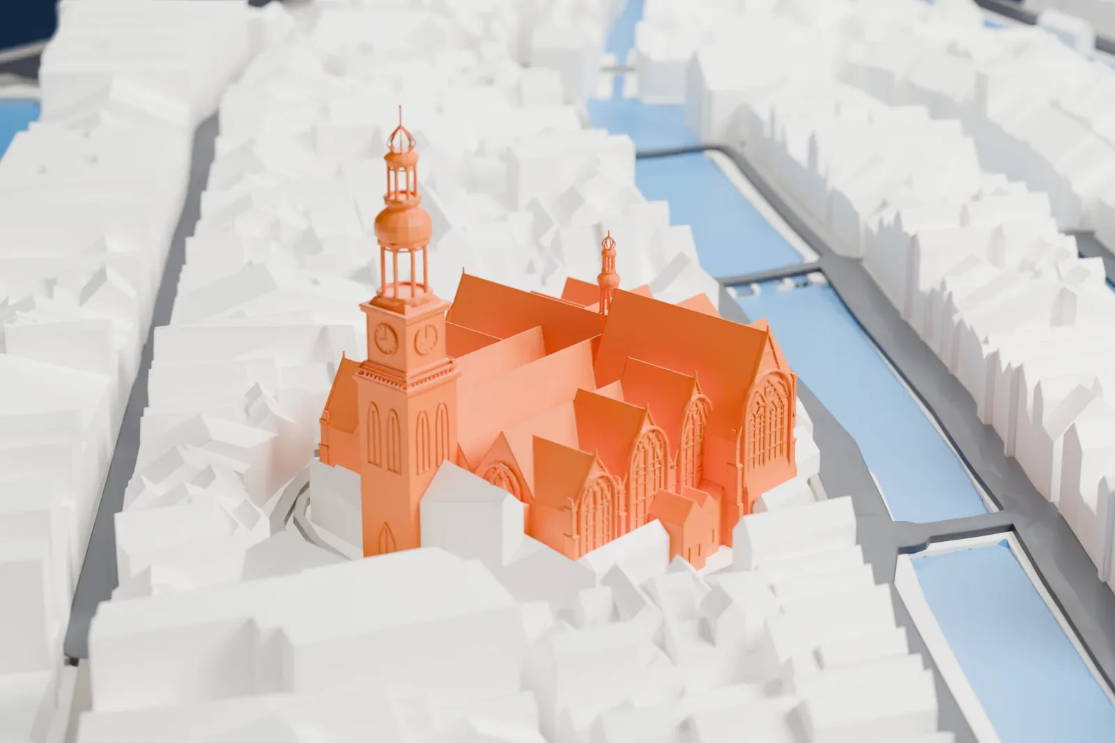 A white 3D print of the Oude Kerk, a brick church with a tower, on its square among the surrounding buildings.