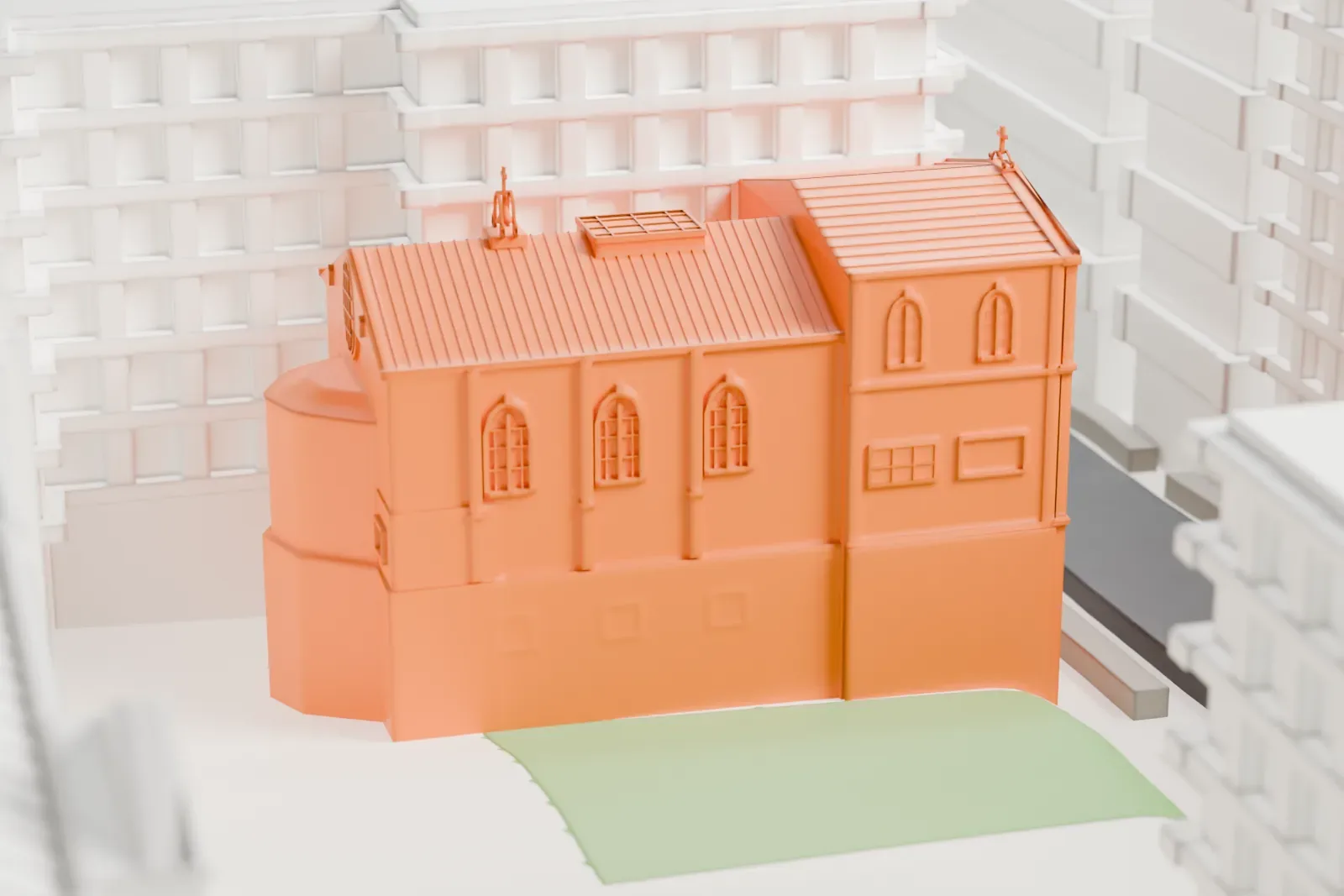 A white 3D print of Our Lady of Esperanza Church, a church with arched windows and a pitched roof topped by a small cross, closely surrounded by taller buildings.