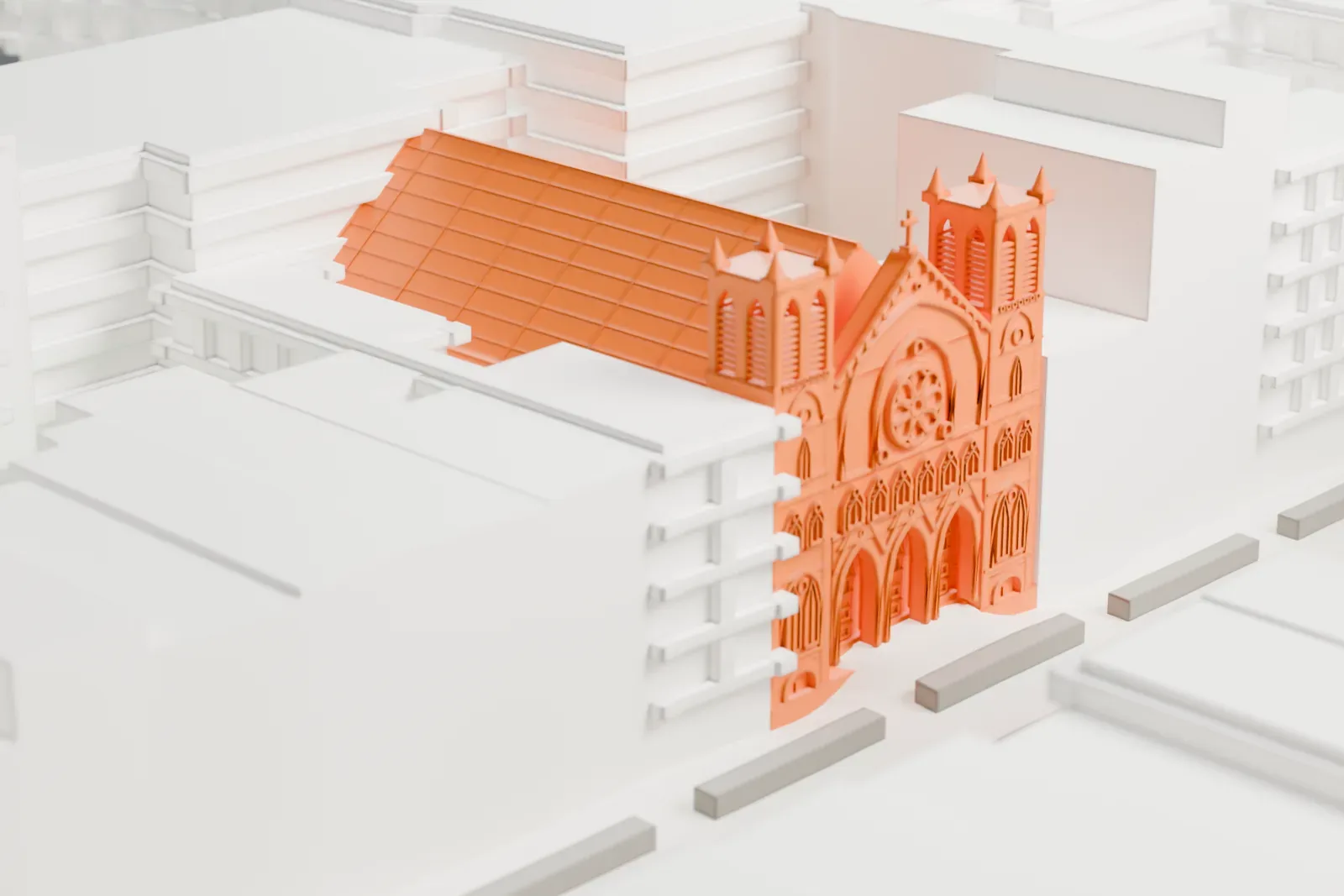 A white 3D print of Our Lady of Guadalupe at St. Bernard Church, with two pinnacled towers and a long pitched roof between taller buildings.