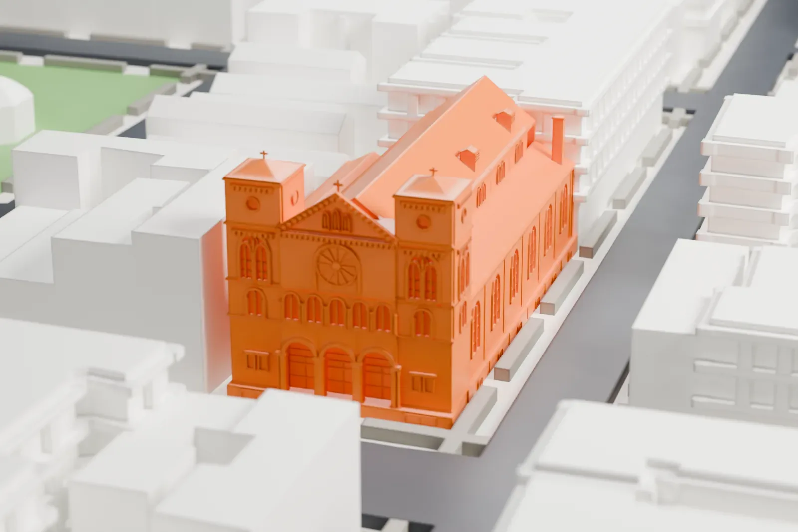 A white 3D print of Our Lady of Mount Carmel Church, a long church with twin towers, squeezed between apartment buildings on Bronx streets.