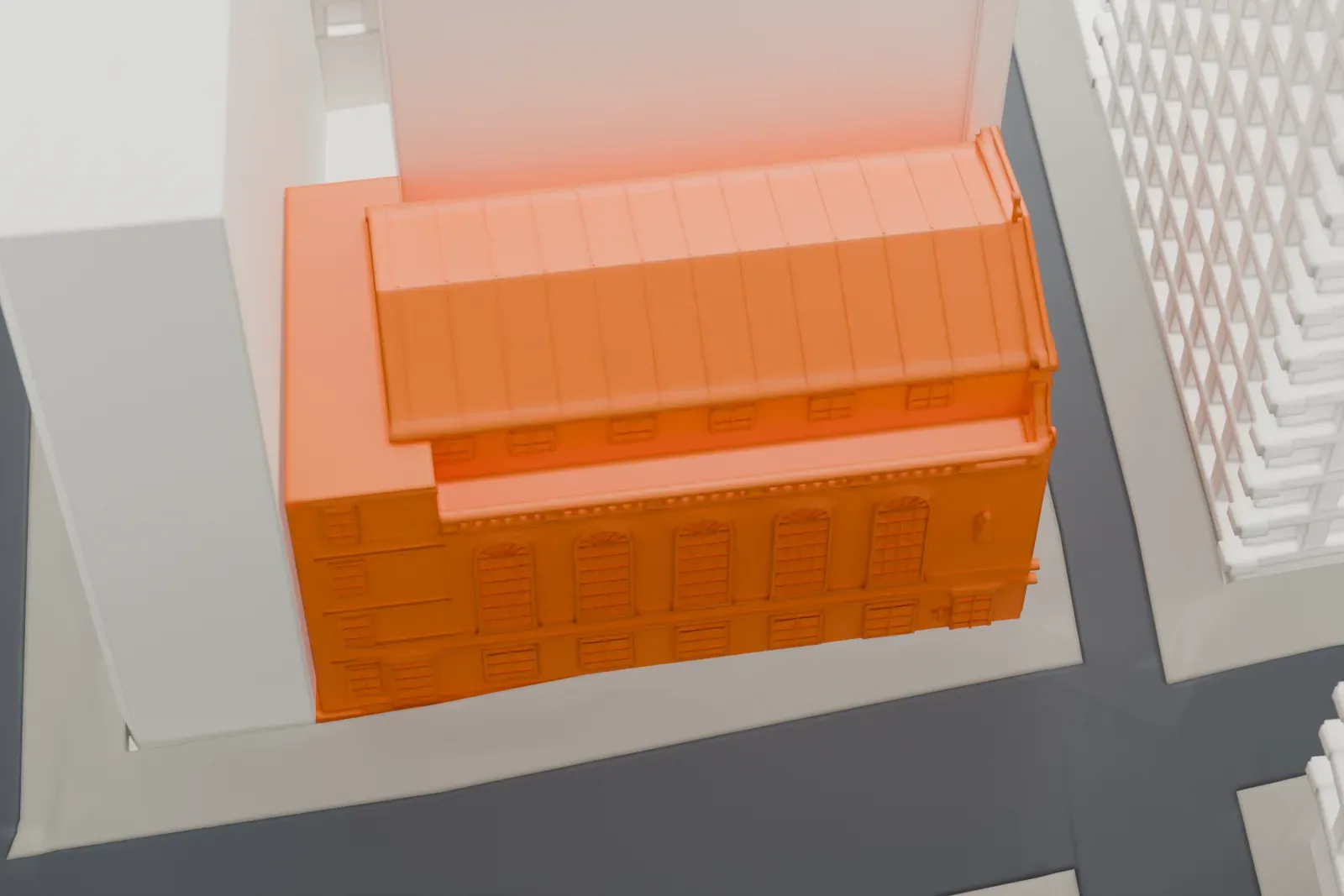 A white 3D print of Our Lady of Victory Church among the surrounding buildings.