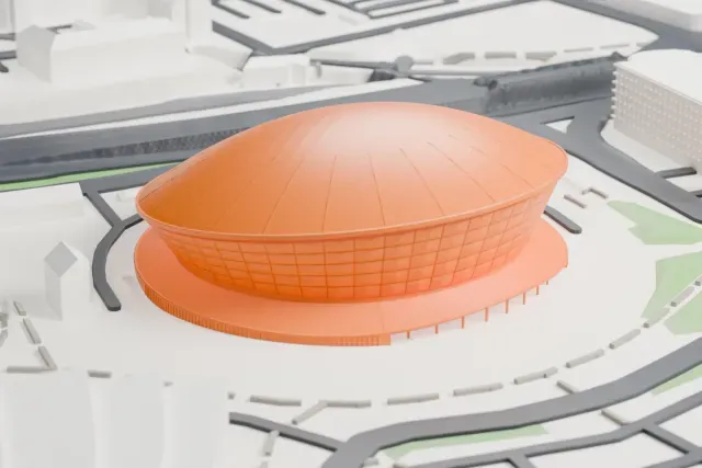 A white 3D print of the OVO Hydro, a round arena with a smooth shallow domed roof over a wall of small panels and a wide flat base ring, with roads and a few buildings around it.