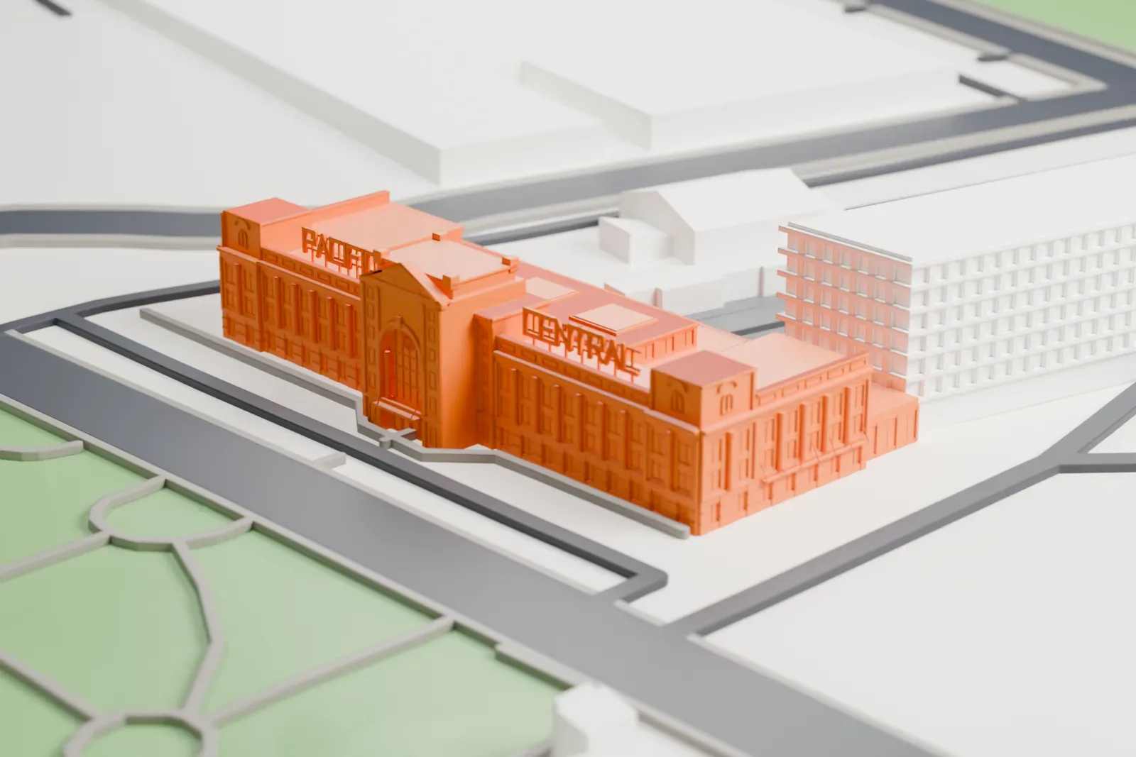 A white 3D print of Pacific Central Station, a railway station in Vancouver, set among the surrounding streets and buildings.