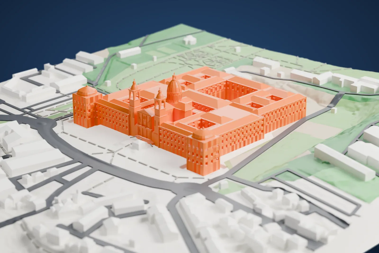 A white 3D print of the Palace of Mafra, a long symmetrical palace with a central dome, two towers and domed corner pavilions, beside gardens and streets.