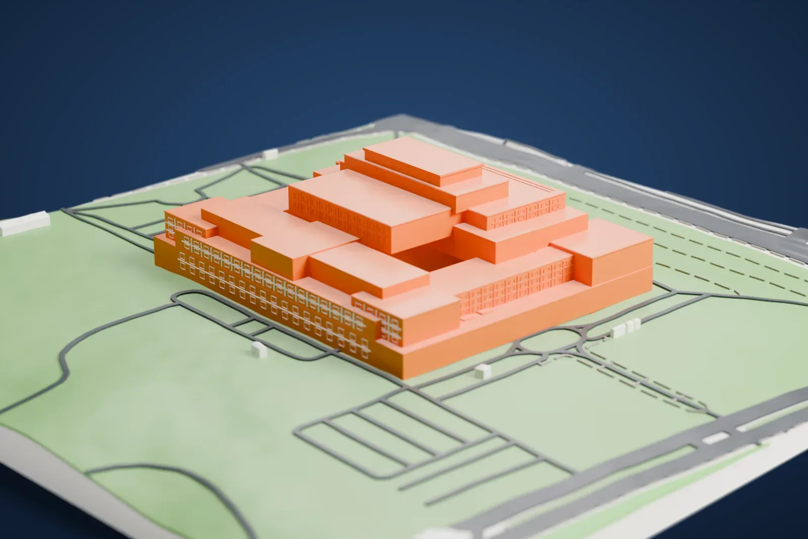 A white 3D print of the Palace of the Parliament, a vast stepped building of stacked rectangular blocks on green grounds with roads curving around it.
