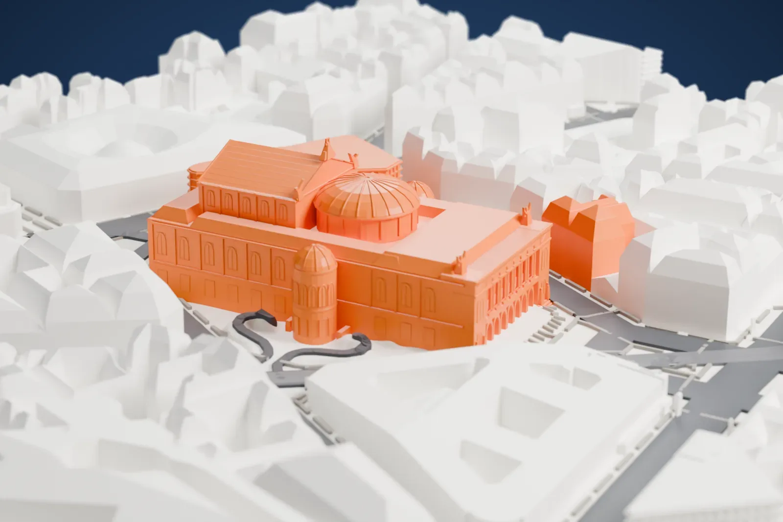 A white 3D print of the Palais Garnier, a large opera house with a ribbed central dome, two smaller domed turrets and an arched front, surrounded by dense city blocks and streets.