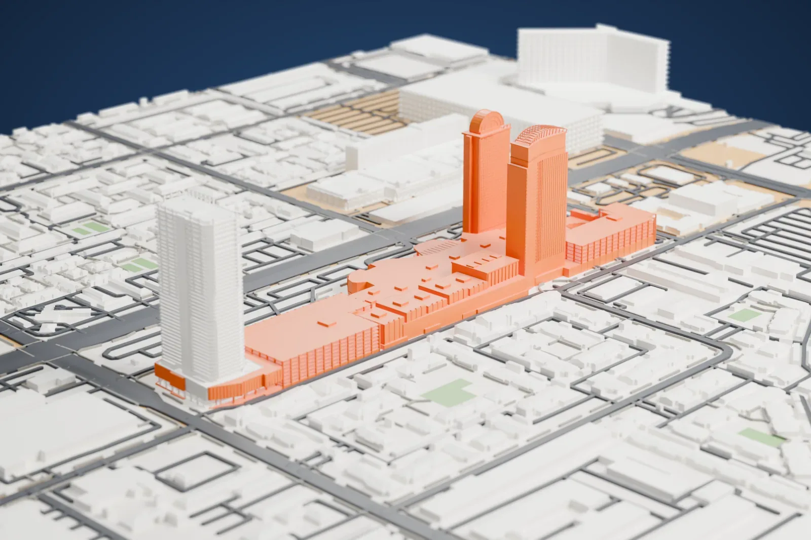 A white 3D print of the Palms Casino Resort, a long low complex with tall towers, surrounded by a grid of streets and low neighborhood buildings.