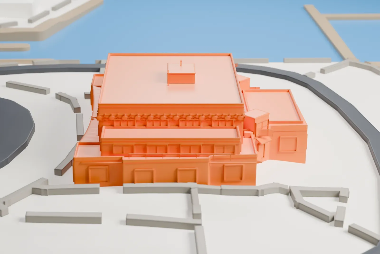 A white 3D print of the Pan American Seaplane Terminal (Miami City Hall), with a flat central roof and lower wings, surrounded by roads, a circular green space, waterfront, and piers.