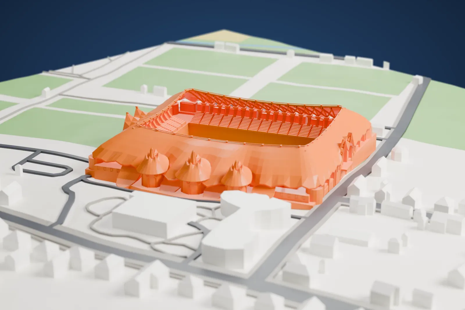 A white 3D print of the Pancho Aréna, with a sweeping curved roof and three domed entrances, among surrounding streets and buildings.