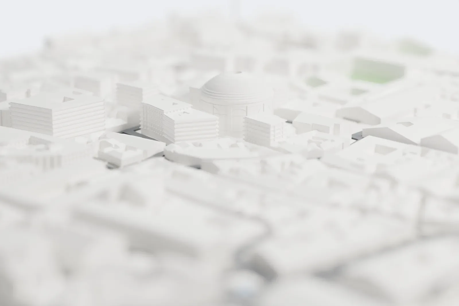 A white 3D print of the Pantheon, a round domed building with an open oculus and a columned porch, set in a small square among dense mid-rise blocks and narrow streets.