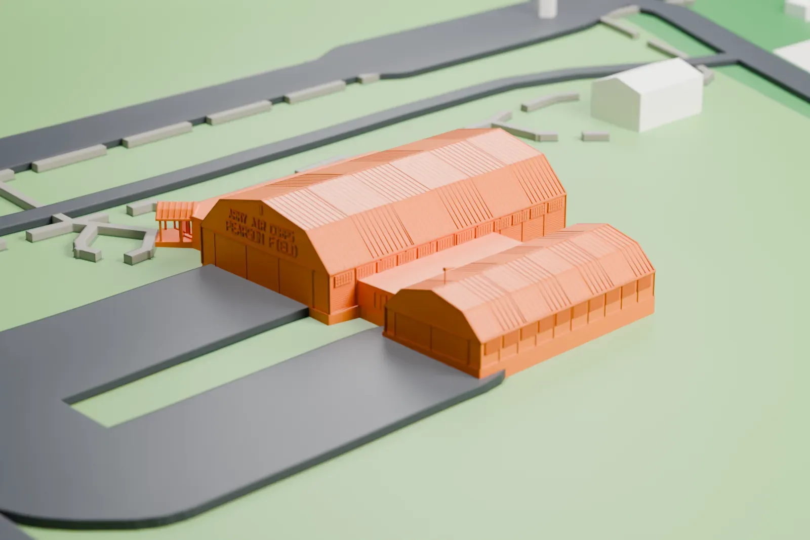 A white 3D print of Pearson Air Museum, a group of broad, low buildings with large roofs and a small gabled porch, on open green ground beside a paved strip.