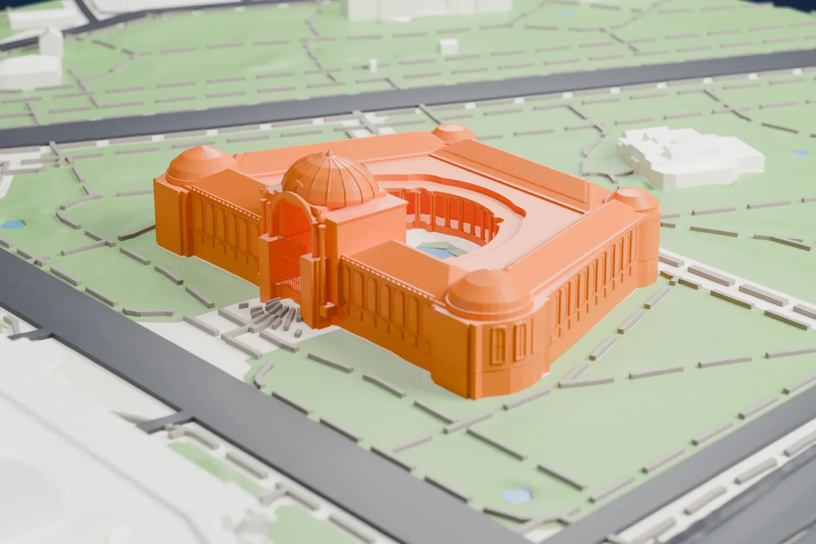 A white 3D print of the Petit Palais, a trapezoid-shaped museum around a semicircular courtyard, with a central dome, rounded corner domes and rows of arched windows, set in green gardens facing a much larger building.