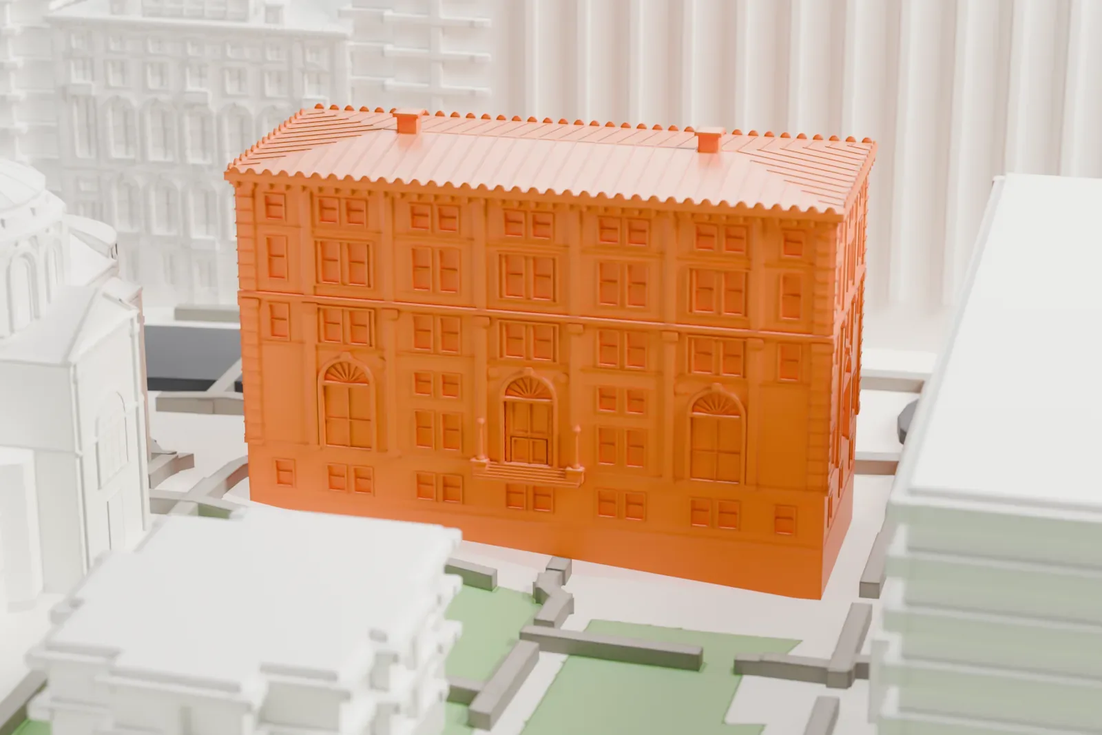 A white 3D print of Philosophy Hall, a rectangular building with a ribbed roof and rows of windows, standing beside a domed neighbor and green lawns on a campus.