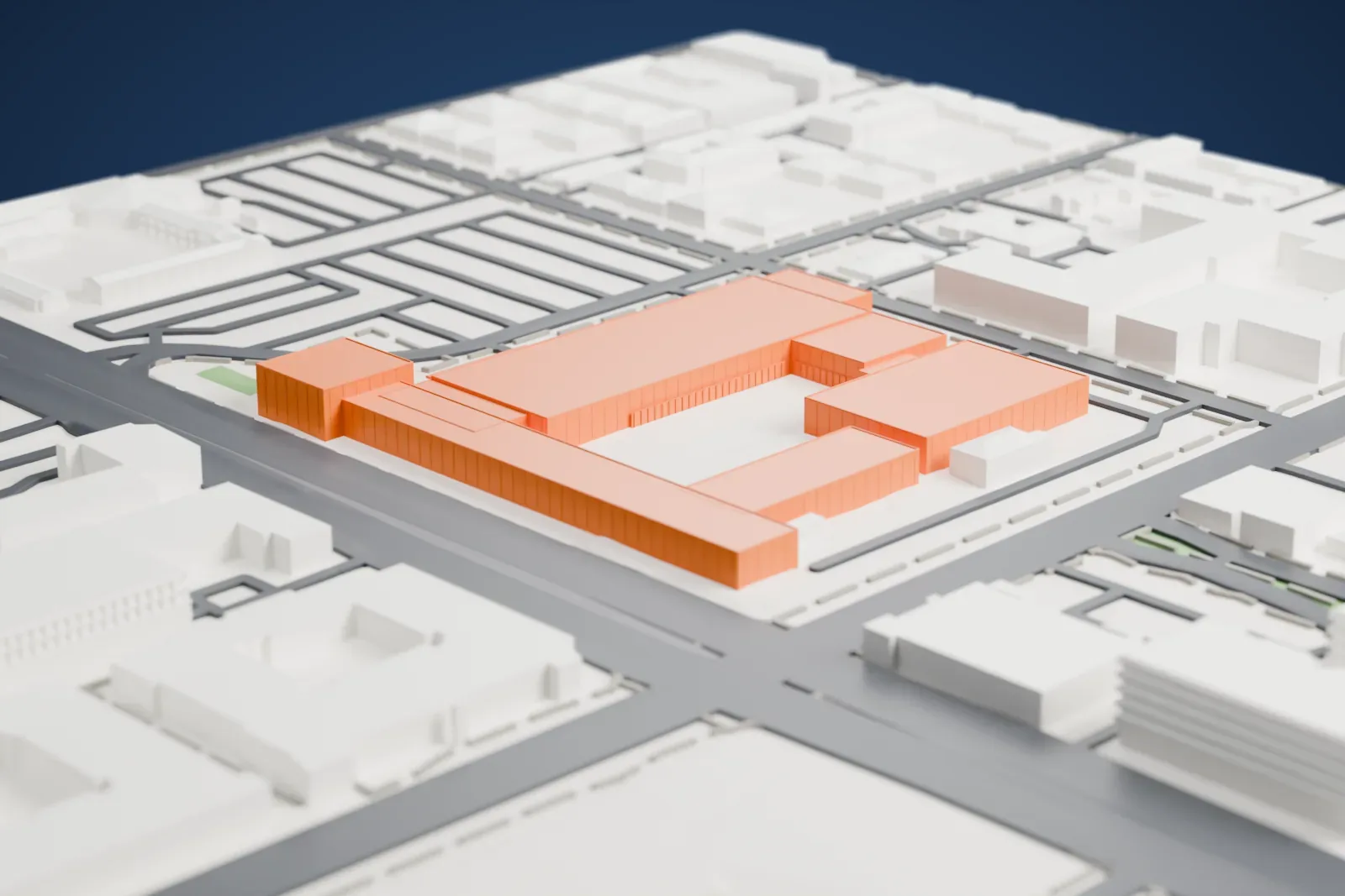 A white 3D print of the Phoenix Art Museum, a cluster of long, low rectangular wings, surrounded by streets, parking lanes and gray city buildings.