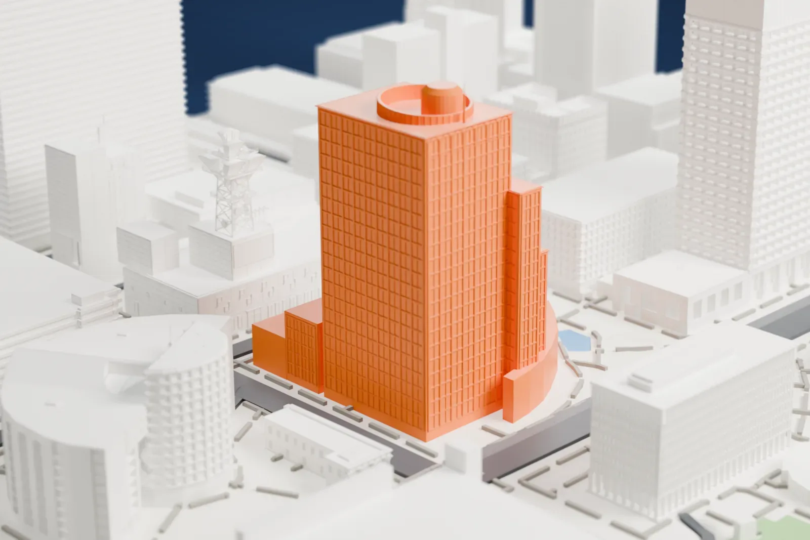 A white 3D print of Phoenix City Hall, a tall rectangular tower with a round structure on its roof, standing among wide streets and lower buildings.